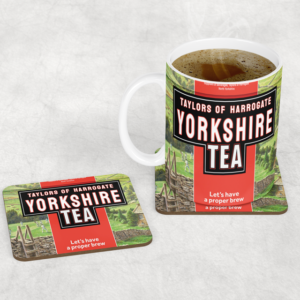 A white ceramic mug and matching square coaster featuring the 'Taylors of Harrogate Yorkshire Tea' brand design, including red and green packaging graphics, stone wall imagery, and the slogan 'Let's have a proper brew'.