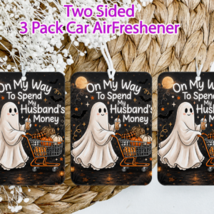 Three-pack car air fresheners featuring a cartoon ghost pushing a shopping cart with pumpkins, displaying the text 'On My Way To Spend My Husband's Money' against a Halloween-themed background.