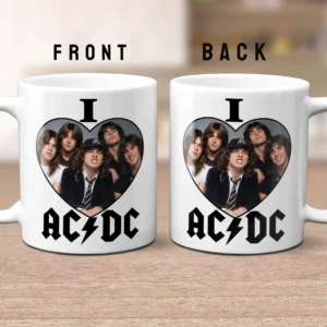 Front and back views of a white ceramic mug featuring a heart-shaped photo collage of AC/DC band members with the text 'I' above and 'AC/DC' below in lightning-bolt font.