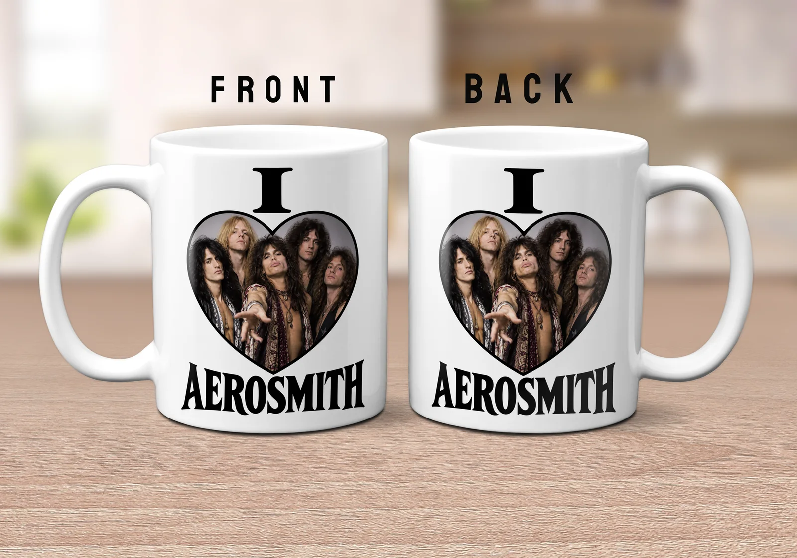White ceramic mug featuring a black heart design containing a photo of the band Aerosmith with the text I and AEROSMITH printed in bold black typography.